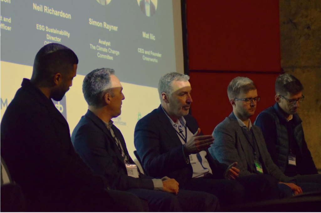 Photograph of the panel discussion at Kamma's Property Zero event:  Hugo Davies, Chief Lending Officer, LendInvest; Neil Sampson, Chief Product and Innovation Officer, Kamma; Neil Richardson, ESG Sustainability Director, OSB; Simon Rayner, Analyst, The Climate Change Committee; Mat Ilic, Co-founder and CEO, Greenworkx. 