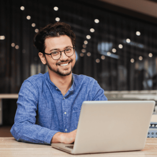 A letting agent working at a laptop