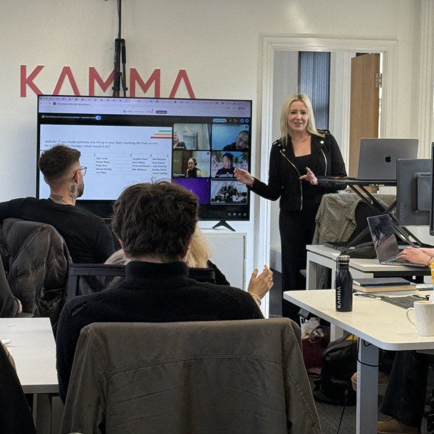 The Kamma team at an internal session in the London office, with colleagues joining remotely on screen