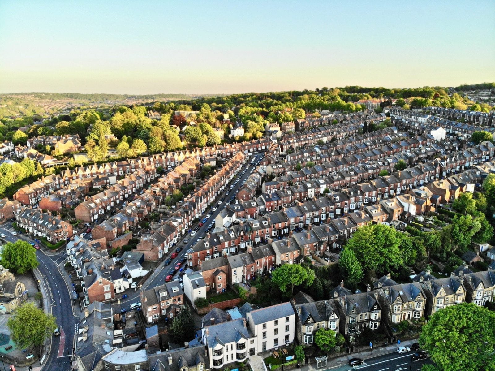An aerial view of rows of terraced houses in a UK city